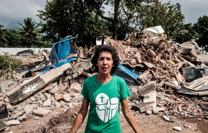 Brazilian Maria da Penha Macena speaks after her house was demolished, at Rio de Janeiro's Vila Autodromo neighbourhood near