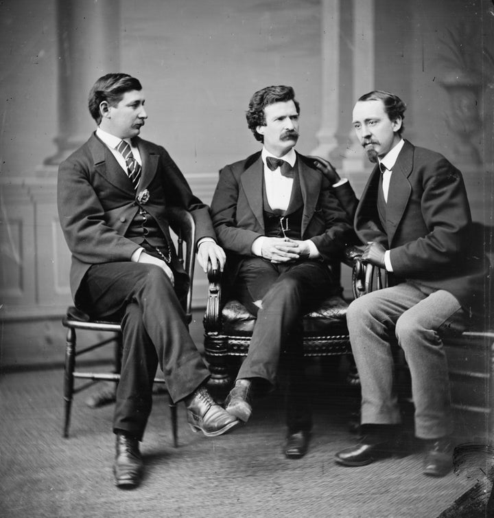 Mark Twain and his fellows George Alfred Townsend and David Gray lounge in suits while also wearing their serious thinking faces.