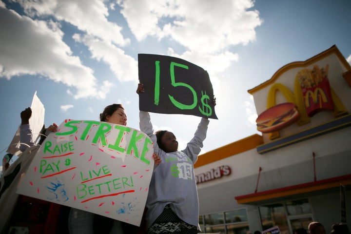 Protesters outside a McDonald's in Los Angeles call for a $15 minimum wage in December 2013.