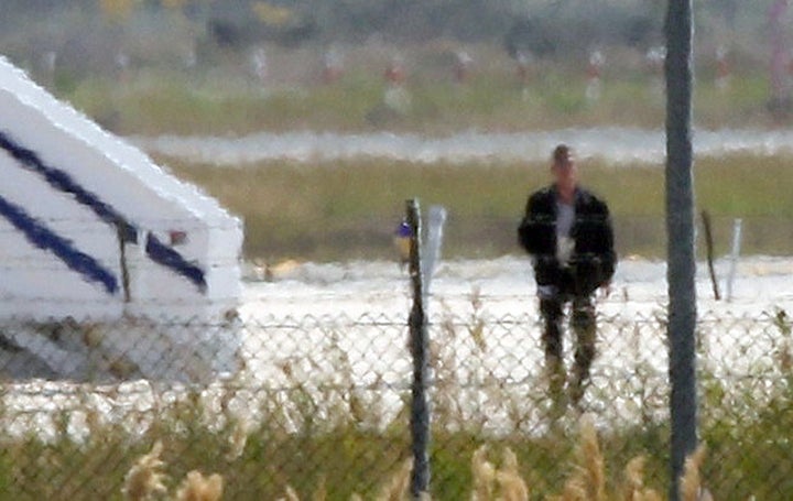 A man thought to be the hijacker leaves the hijacked Egyptair Airbus A320 at Larnaca Airport in Larnaca, Cyprus, on Tuesday.