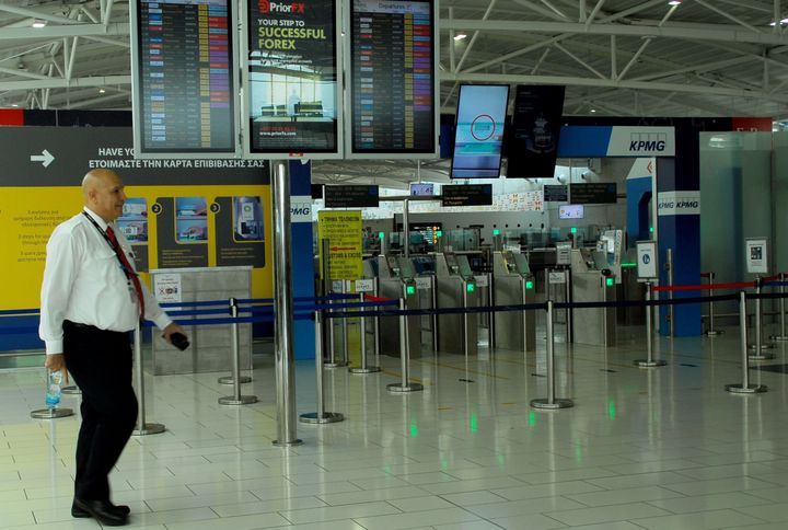 The incident has raised renewed questions over airport security in Egypt, though it was not clear whether the hijacker was even armed. A staffer walks through the deserted departure lounge of Cyprus' Larnaca airport that was closed down after the hijacking.