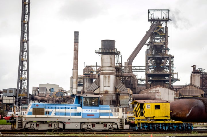 A train carrying molten iron in front of the steel factory building at the Tata steel plant in Port Talbot.