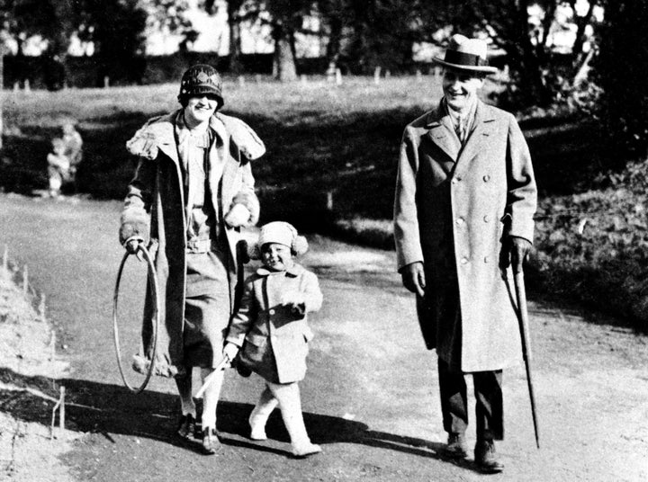 Zelda Fitzgerald and her husband, F. Scott Fitzgerald, walk with their daughter, Scottie.