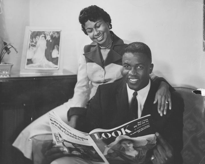 Rachel Robinson and her husband, Jackie Robinson, read Look Magazine.