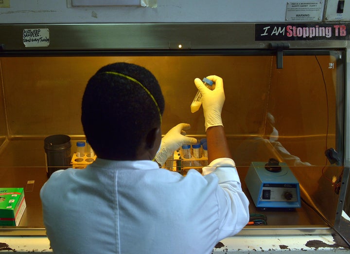 A laboratory technician tests sputum samples for tuberculosis strains at a Medecins Sans Frontieres (MSF)-run clinic in Nairobi on March 24, 2015, World Tubeclosis Day. (Photo credit should read TONY KARUMBA/AFP/Getty Images)