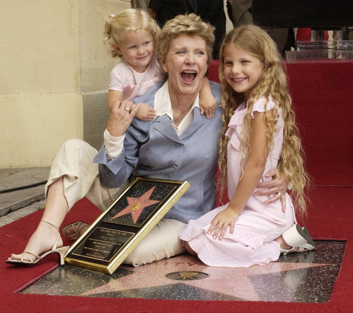 Patty Duke poses for photographers with her granddaughters, 2-year-old Elizabeth Astin and 7-year-old Alexandra Astin following an unveiling ceremony, honoring Duke with a star on the Hollywood Walk of Fame in Los Angeles, California August, 17, 2004.