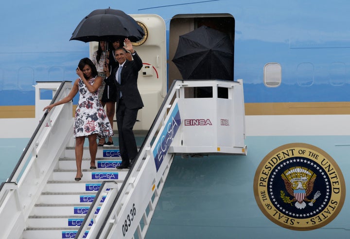 U.S. President Barack Obama, his wife Michelle, and their daughters Malia and Sasha, exit Air Force One as they arrive at Havana's international airport for a three-day trip, in Havana on March 20, 2016.