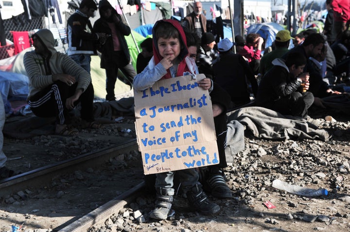 This young boy joined the protesters on the tracks, holding a placard reading "I hope I become a journalist to send the voice of my people to the world." 