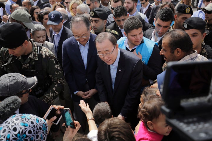 UN Secretary General Ban Ki-moon and World Bank President Jim Yong Kim meet Syrian refugees during their visit in Hay al-Tanak, an impoverished district that was turned into an informal Syrian refugee camp in the northern Lebanese city of Tripoli on March 25, 2016.