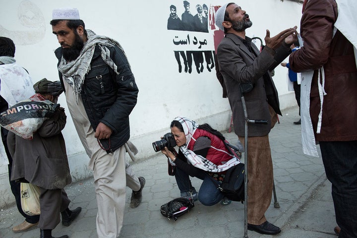 Mariam Alimi, a participant in Sahar Speaks, photographs in Kabul. Sahar Speaks was borne out of Ferris-Rotman's anger a