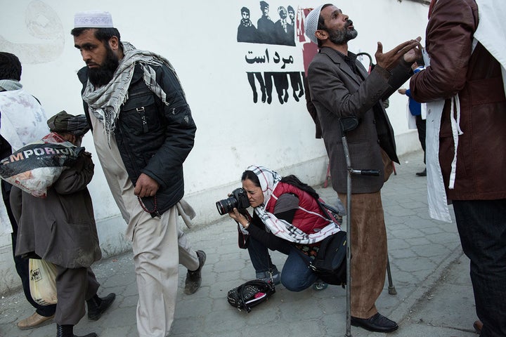 Mariam Alimi, a participant in Sahar Speaks, photographs in Kabul. Sahar Speaks was borne out of Ferris-Rotman's anger at the sexist system of Afghanistan's foreign media landscape.