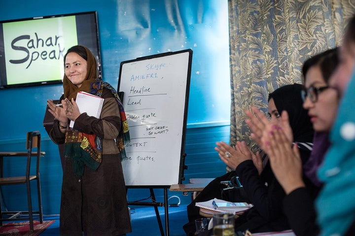 People often tugged at the curtains of the Sahar Speaks classroom, which is located in a blue metal box in the middle of a ya