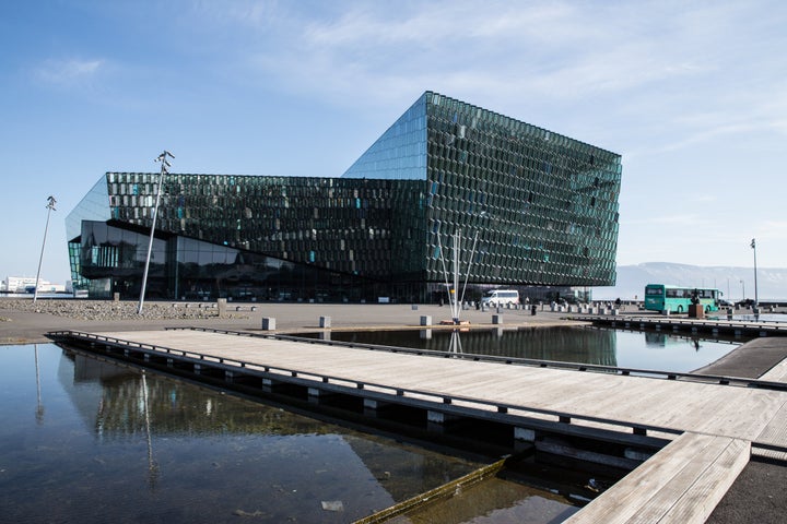 A couple of Rhode Island locals were the ones who noticed the background building's resemblance to the Harpa Concert Hall, pi
