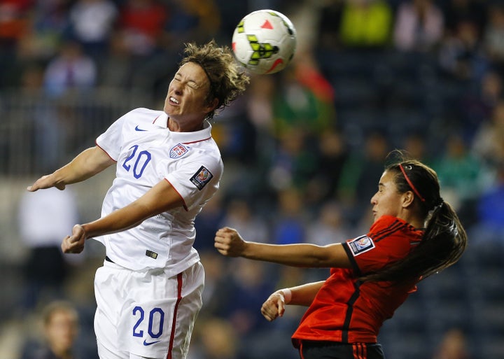 Wambach throws herself into one of her trademark thumping headers. 