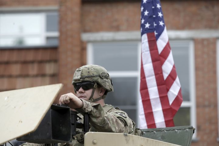 A U.S. soldier sits in his Humvee during the NATO Force Integration Unit inauguration event in Vilnius, Lithuania on September 3, 2015. This week, the Pentagon announced plans to beef up U.S. military presence in Eastern Europe.