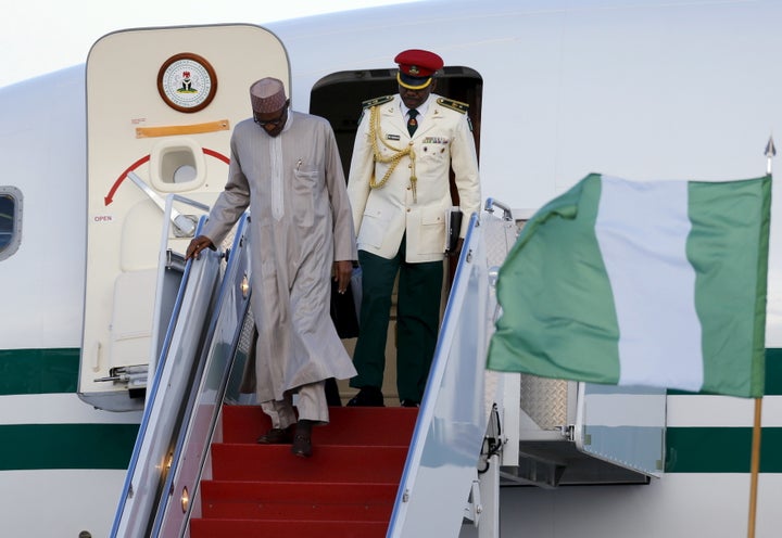Nigeria's President Muhammadu Buhari (L) arrives on his official plane on March 30 to attend the Nuclear Security Summit in W