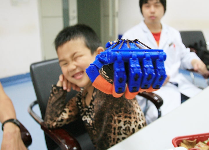 Longhua Funeral Parlor's 3D printing venture is part of Shanghai's implementation of the country's Five-Year Plan, which pushed for more innovation in science and technology. A boy who had lost five fingers tries out a 3D-printed limb in Wuhan, China.