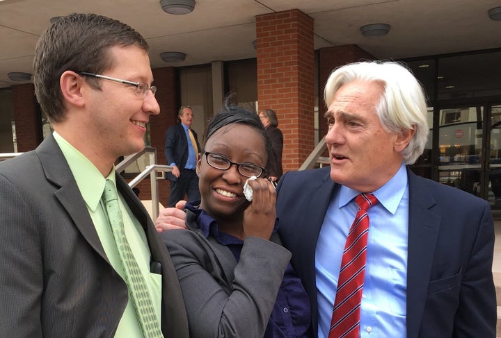 Cherelle Baldwin, pictured just moments after being released from custody, stands in front of the courthouse with her lawyers.