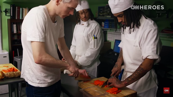 Chrostowski teaches a student some knife skills.