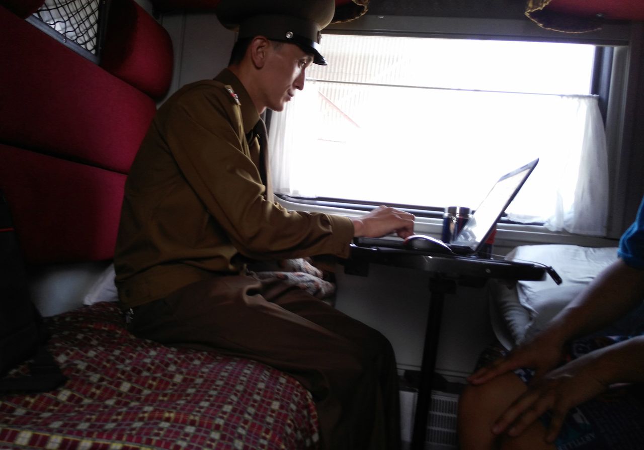 North Korean authorities, from train conductors to local police officers, can examine digital devices such as cameras, cell phones and laptops, Chu said. A customs officer inspects a passenger's laptop at Tumangang railway station.