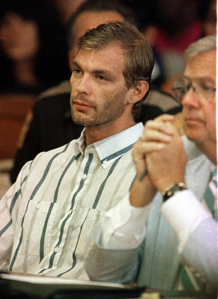 Jeffrey Dahmer, left, pictured during his initial court appearance in Milwaukee County Circuit Court in July 1991. He was wearing the shirt of one of his 17 victims.