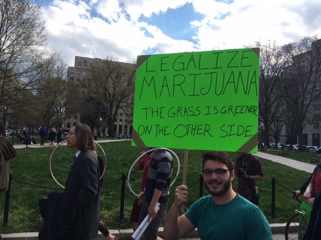 A protester marches on K Street in Washington, D.C. on April 2, 2016, after smoking marijuana in front of the White House.