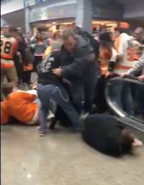Philadelphia Flyers fans were seen being thrown off an escalator after beating the Ottawa Senators on Saturday.