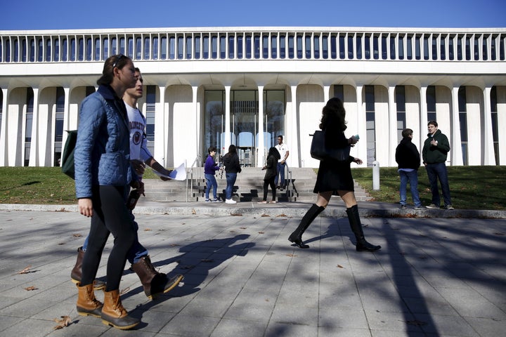 People walk past Princeton University's Woodrow Wilson School of Public and International Affairs in Princeton, New Jersey, November 20, 2015. 