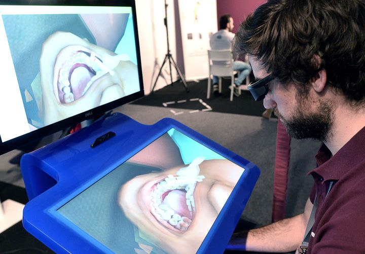 Students can use virtual reality scenarios, like this dental care simulator, to practice medical procedures. 
