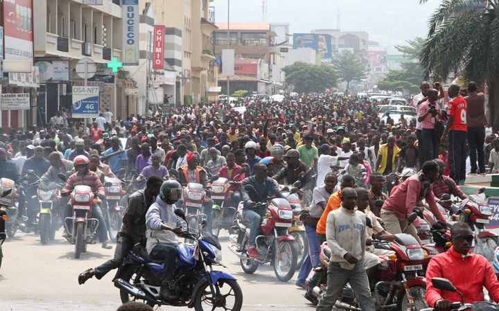 Reductions in foreign aid have left Burundi's capital Bujumbura struggling to meet its financial obligations. Pictured here, residents participate in a demonstration against the Rwandan government in Bujumbura on Feb. 13, 2016.