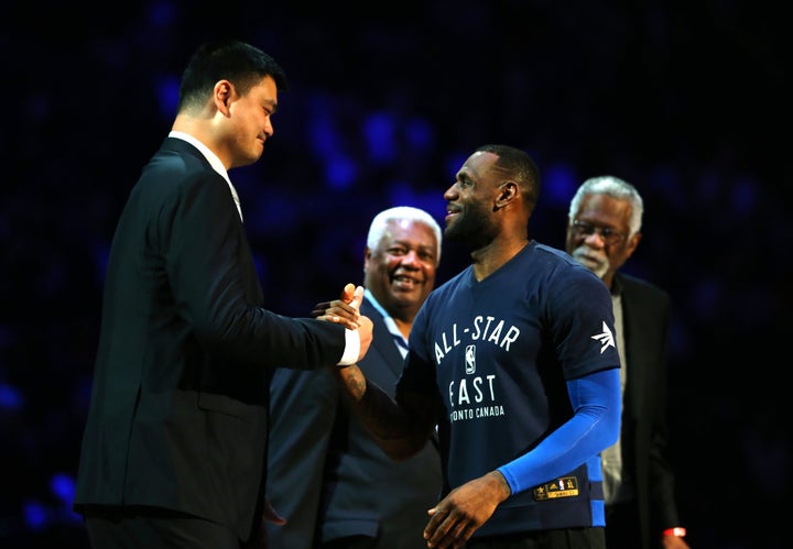 Two future Hall of Famers dap it up. 