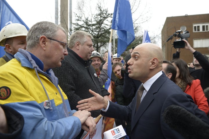 Business Secretary Sajid Javid talks to workers as he leavesTata Steel in Port Talbot