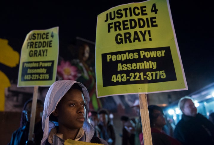 Residents demonstrate in reaction to a mistrial declared in the trial of police officer William Porter in Baltimore, Maryland on December 16, 2015.