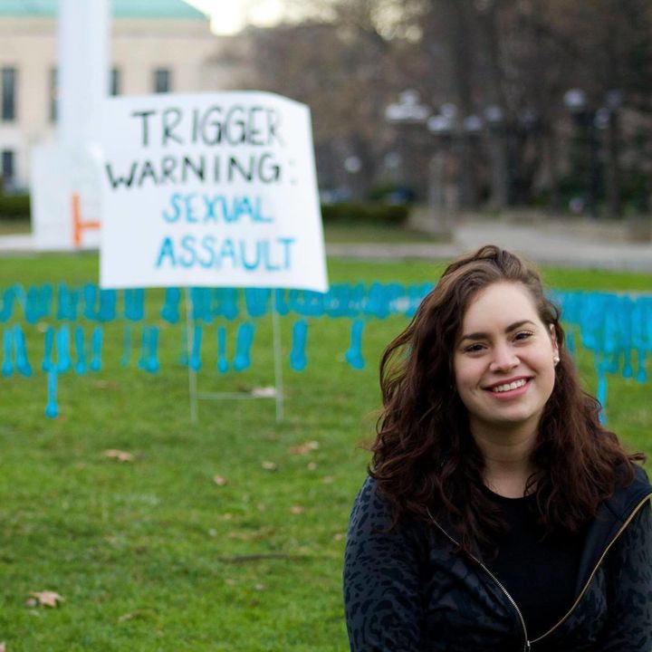 Fabiana Diaz poses next to a sexual assault awareness placard from a demonstration she organized at the University of Michigan in April 2015.