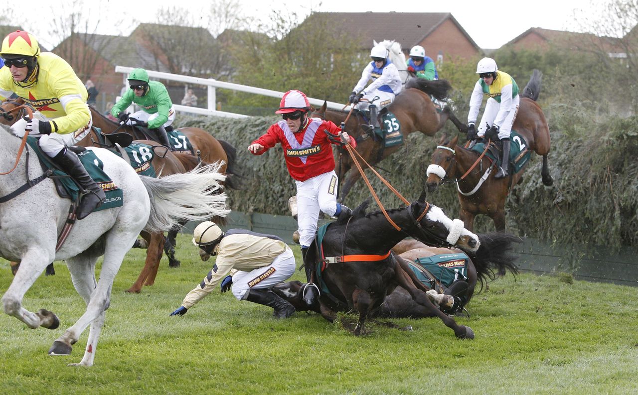 According to Pete and jockey Henry Haynes and On His Own and Paul Townend fall at Bechers in the John Smith's Grand National Steeple Chase during day three of the 2012 John Smith's Grand National meeting at Aintree Racecourse, Liverpool.