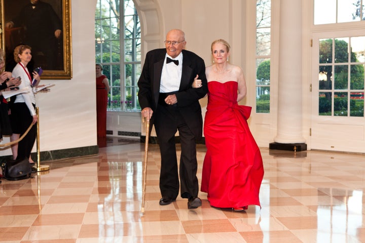 John and Debbie Dingell arrive for a state dinner at the White House in honor of British Prime Minister David Camer