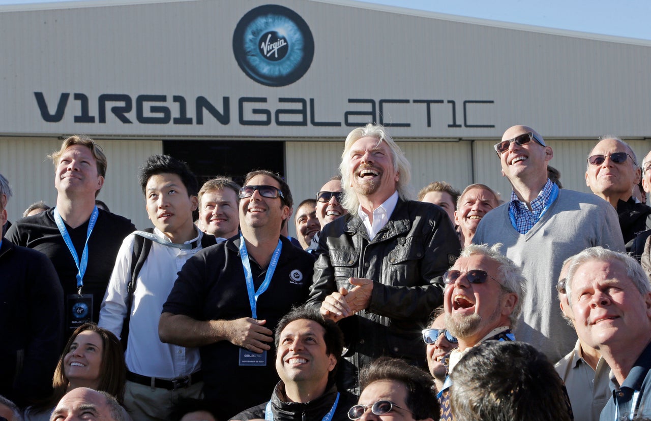 Branson with some of 300 people who have paid for a future flight into space with Virgin Galactic.