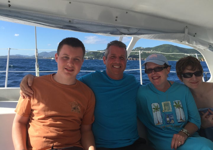 Conner, John, Kelly and Megan Halligan smile while on vacation. John says they have all been trying hard to heal after losing Ryan more than a decade ago.