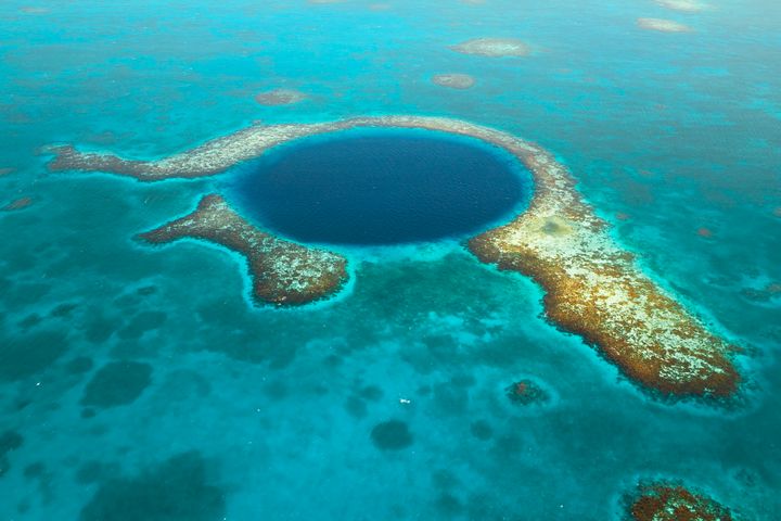 The Great Blue Hole in Belize. The site is part of the Belize Barrier Reef Reserve System that is protected with World Heritage status.
