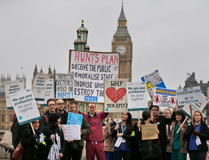 <strong>Junior doctors show banners as they start a 48-hour strike at the St Thomas Hospital in London today</strong>