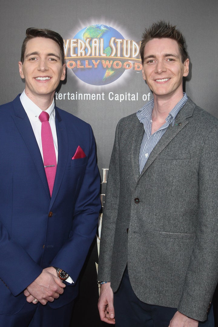 Actors Oliver Phelps (L) and James Phelps attend the Universal Studios Hollywood Hosts The Opening Of 'The Wizarding World Of Harry Potter.' 