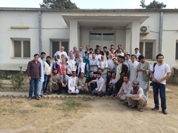 This August 2015 photograph shows MSF national and international staff outside the main entrance to the MSF Trauma Center in Kunduz.
