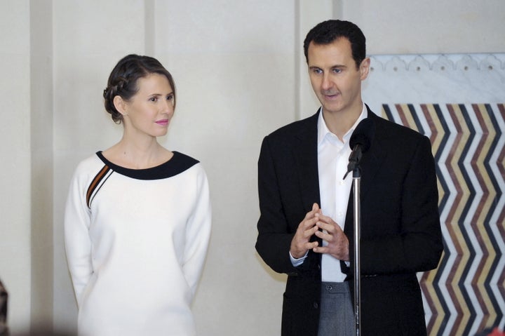 Assad and his wife Asma pictured in Damascus in March. At least 470,000 people have died in the country's ongoing war since 2011, a Syrian research group estimated earlier this year.