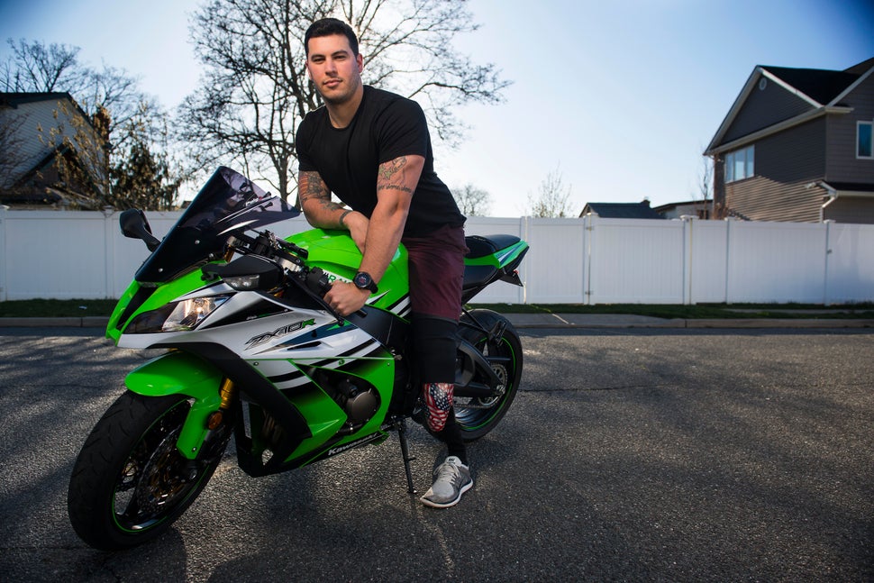 Matias Ferreira and his motorcycle, outside his home in Merrick, New York. 