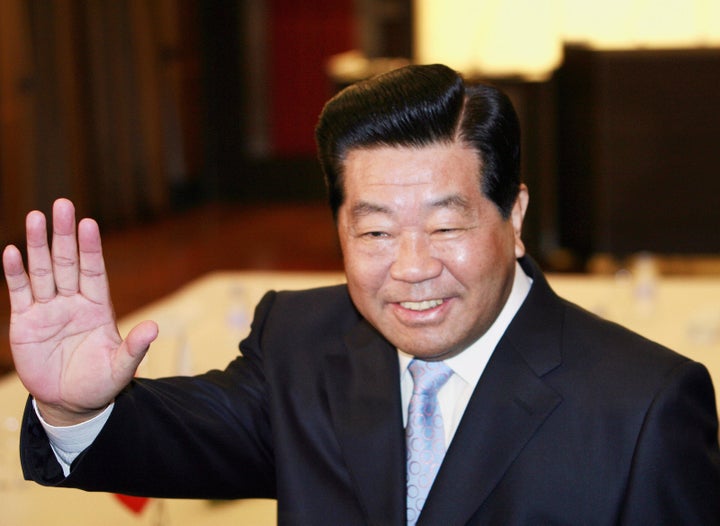 Jia Qinglin, chairman of the Chinese People's Political Consultative Conference, arrives at a hotel room to meet Japan's ruling Liberal Democratic Party Secretary General Taro Aso, 13 September 2007, in Tokyo