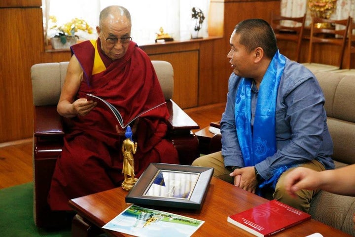 The Dalai Lama and M.BATAA, a member of the project's board of trustees and former Tibetan Buddhist monk, discuss plans for the site during a spiritual advisory meeting.