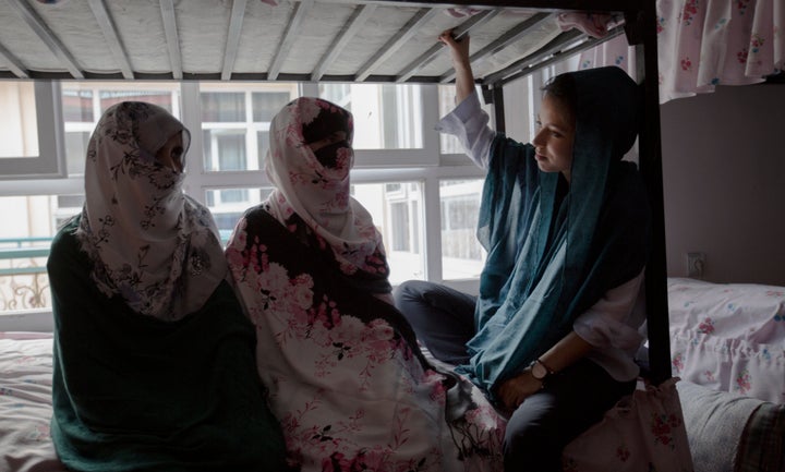 VICE correspondent Isobel Yeung speaks with two sisters-in-law at a women's shelter in Afghanistan who fled their abusive fam