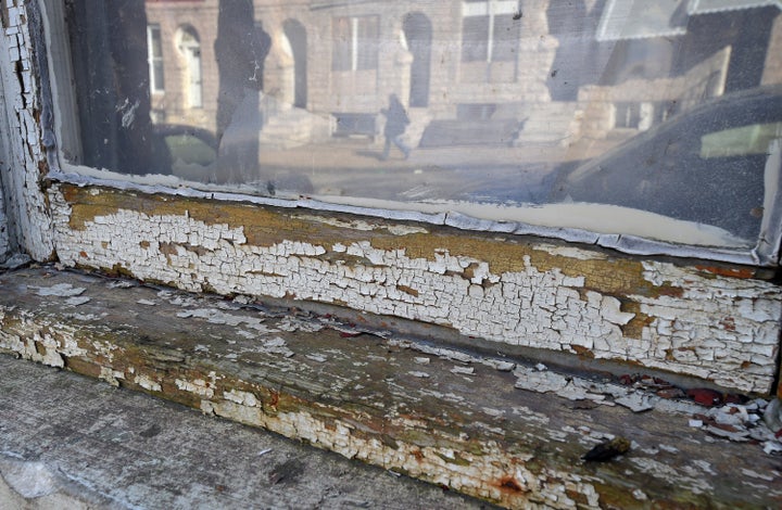 A home in Baltimore, Maryland with chipping lead paint on the widow.