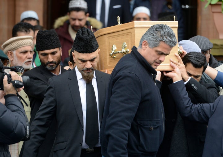 Mourners carry the coffin of Asad Shah at the Bait Ur Rahman Mosque on April 2