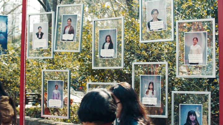 In the video, the women go to a "marriage market" in Shanghai -- but instead of seeking partners, they post messages celebrating their singledom and asking their parents to understand their viewpoint.